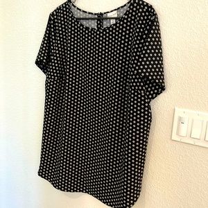 Women’s top is polyester and spandex and machine washable